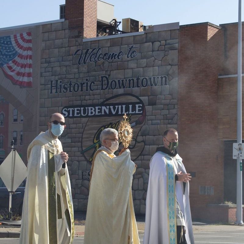 Procession Past Downtown Mural